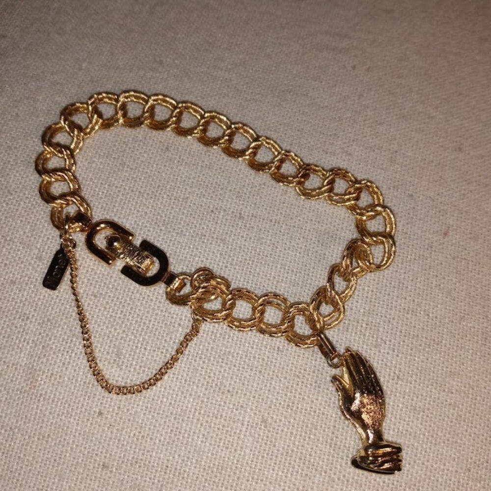 Monet: Gold tone Lord's prayer bracelet.